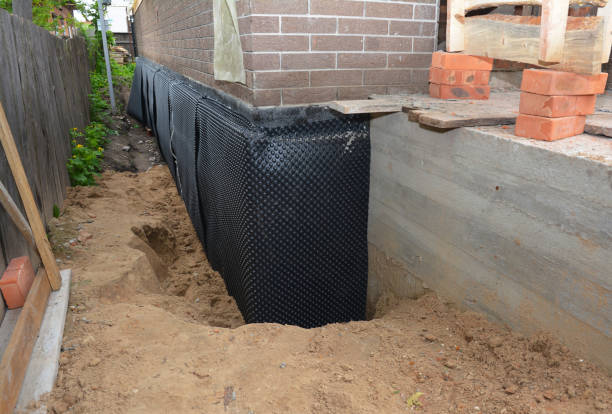 Happy homeowners after waterproofing job in Mantoloking